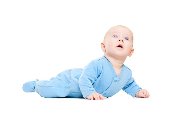 Hübsches Baby auf dem Boden liegend und aufblickend — Stockfoto