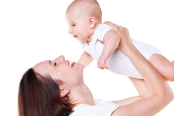 Riendo madre sosteniendo a su bebé —  Fotos de Stock