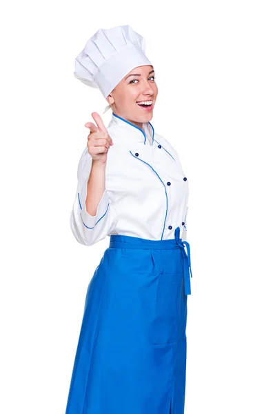 Sorridente jovem cozinheiro apontando dedo — Fotografia de Stock