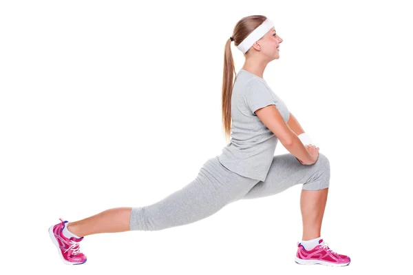 Giovane donna attiva che fa stretching — Foto Stock