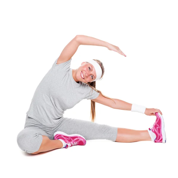 Fitness veselá žena sedí — Stock fotografie