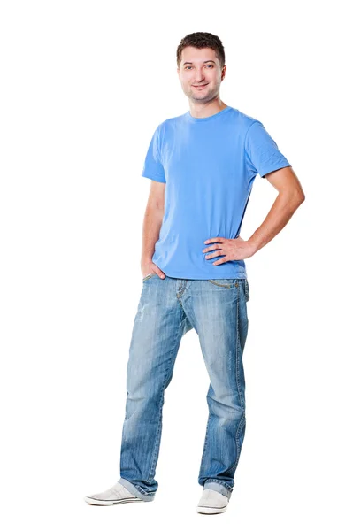 Pohledný muž v tričku a džínách — Stock fotografie