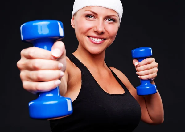 Healthy young woman with blue dumbbells — Stock Photo, Image