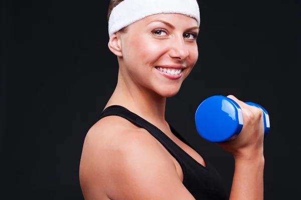 Woman doing exercises for biceps — Stock Photo, Image