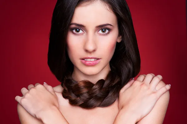 Brunette girl with creative braid hairdo — Stock Photo, Image