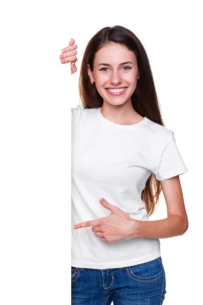 Attractive girl pointing at empty blank — Stock Photo, Image