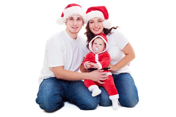 Christmas family sitting on floor — Stock Photo, Image