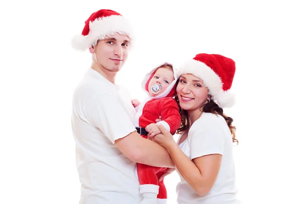 Família feliz em chapéus de Santa — Fotografia de Stock