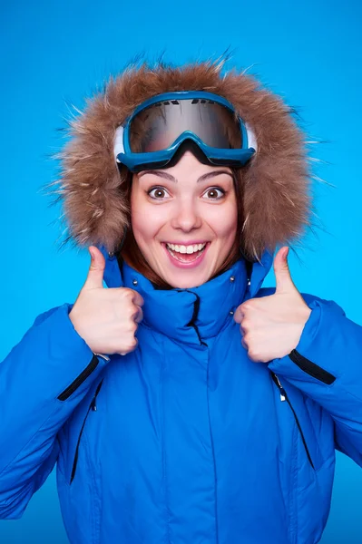 Lively skier over blue background — Stock Photo, Image