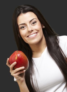 Woman holding a mango