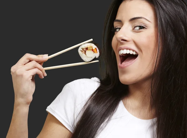 Woman holding sushi — Stock Photo, Image