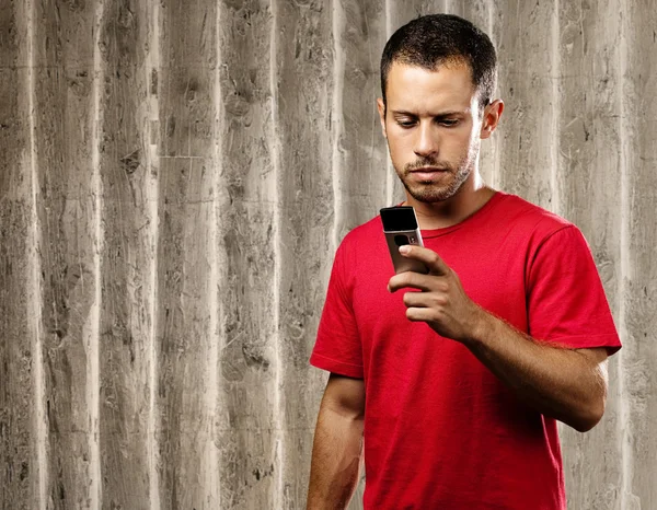 Young man with mobile phone — Stock Photo, Image