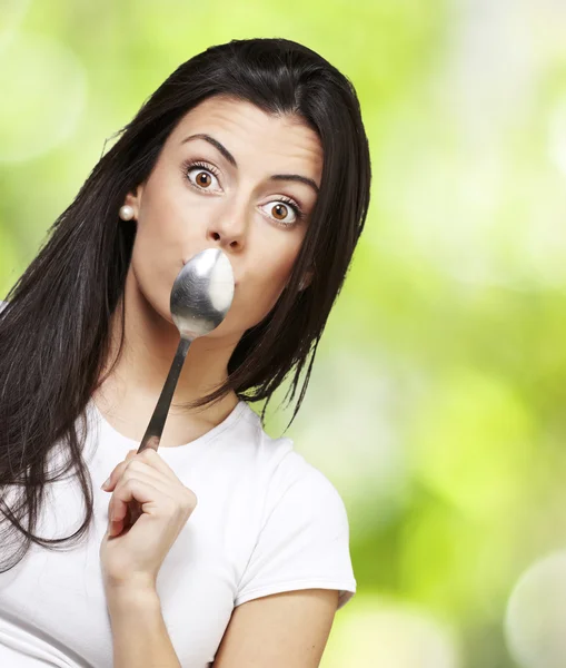 Woman holding a spoon — Stock Photo, Image