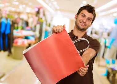 Man Holding Shopping Bag clipart