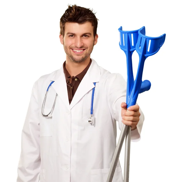 Doctor Holding Crutches Isolated On White Background — Stock Photo, Image