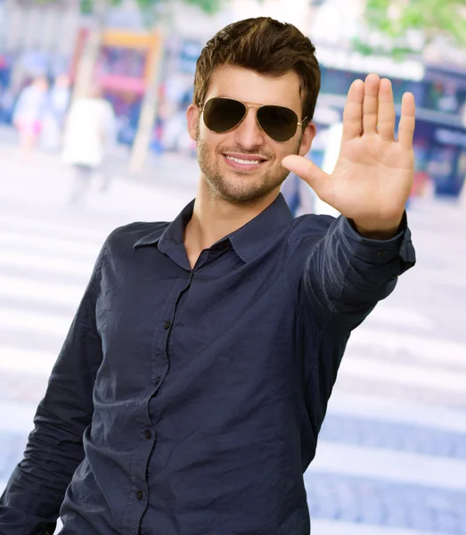 Portrait Of Young Man Doing Stop Signal — Stock Photo, Image