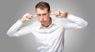 Portrait Of Young Man With Finger In His Ear clipart