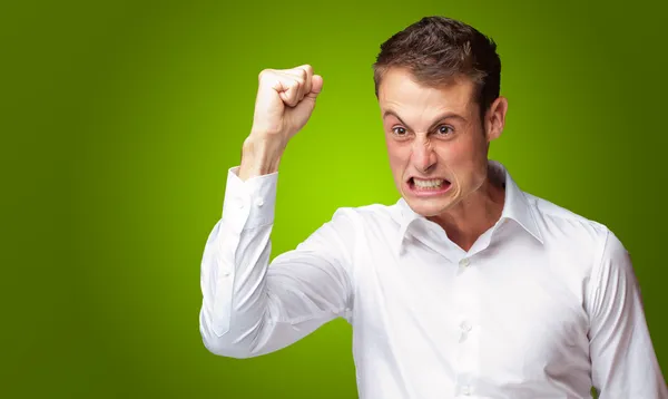 Portrait Of Angry Young Man Clenching His Fist — Stock Photo, Image