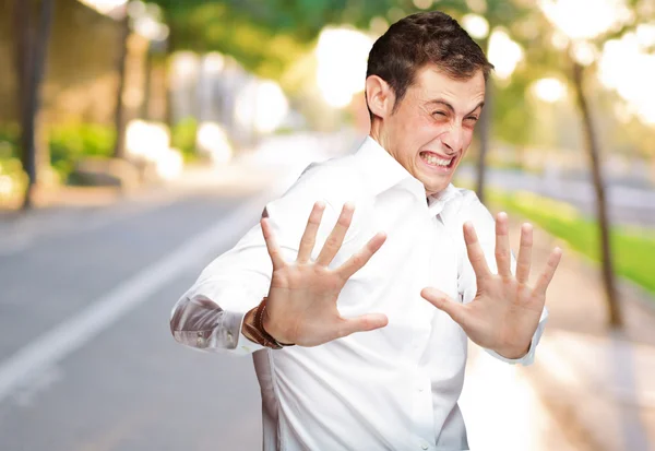 A Young Man Holding His Hands Out In Fear — Stock Photo, Image