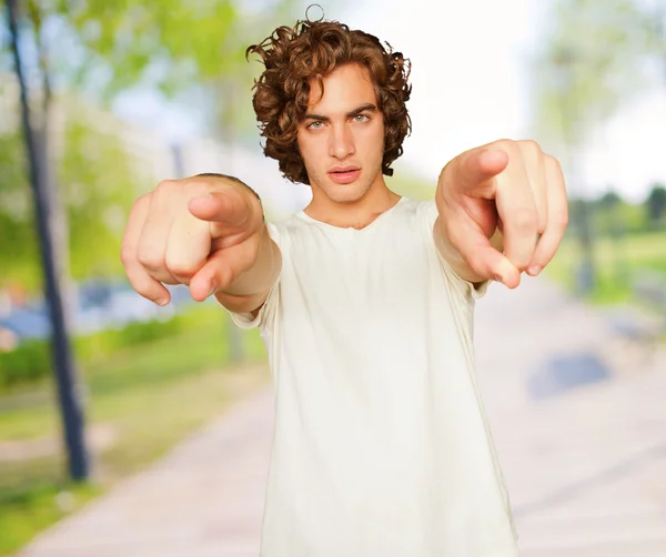 Portrait Of Young Man Pointing With Hand — Stock Photo, Image