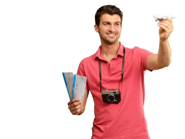 Άνθρωπος που κρατά την κάρτα επιβίβασης και το αεροπλάνο — Φωτογραφία Αρχείου