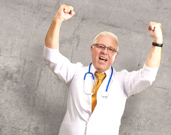 Senior Male Doctor In A Winning Gesture  — Photo