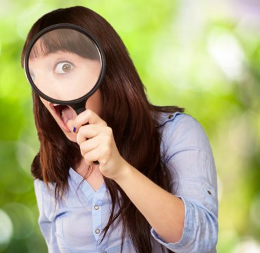 Woman Holding Magnifying Glass clipart