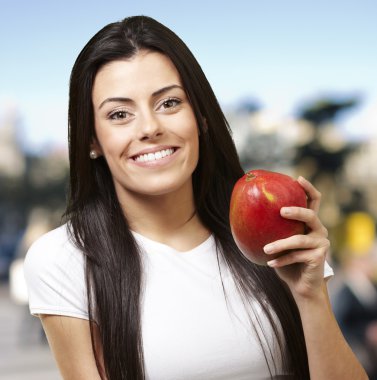 Woman holding a mango clipart