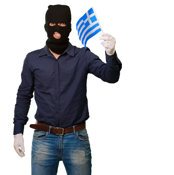 Man wearing robber mask and holding flag — Stock Photo, Image