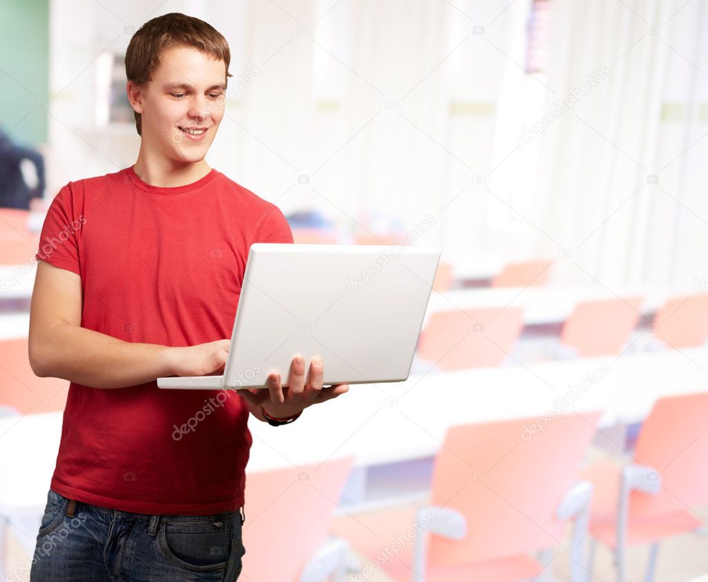Happy man using laptop