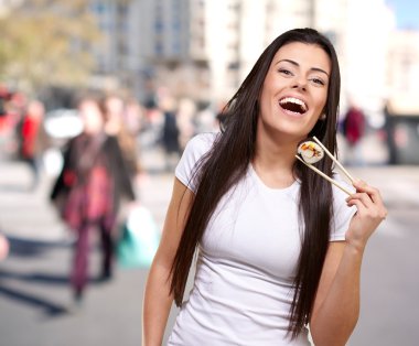 Portrait of young woman at crowded city clipart