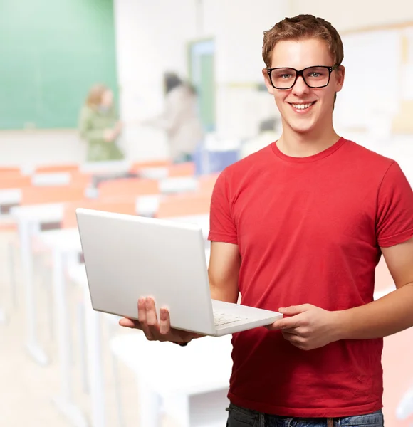 Portrait Of A Young Man Holding A Laptop — Stock Photo, Image