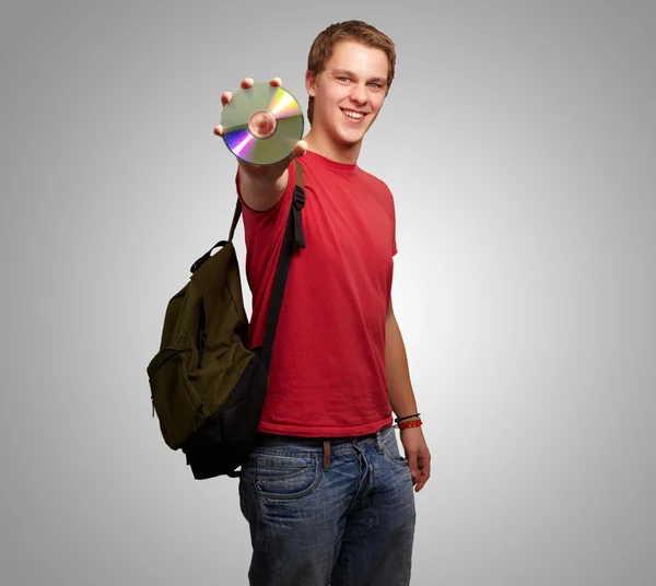Retrato de um estudante segurando um disco compacto — Fotografia de Stock