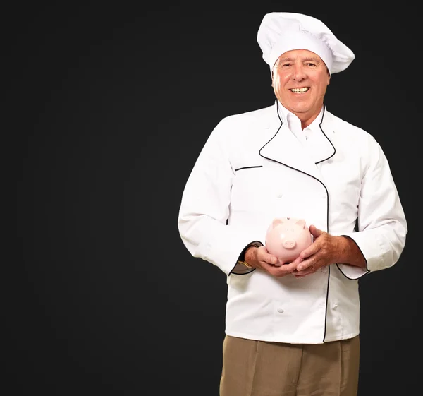 Portrait Of A Chef Holding Piggy Bank — Stock Photo, Image
