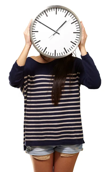 若い女の子表示時計と彼女の顔を非表示 — ストック写真