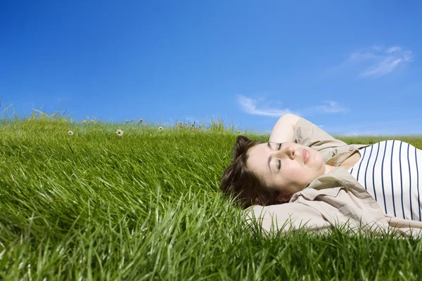 stock image Woman lyind on green meadow