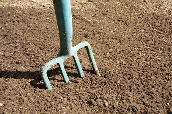 Fork in soil — Stock Photo, Image