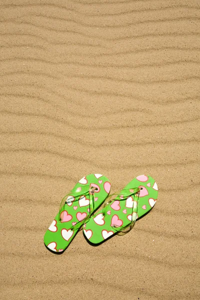 Flip flops on beach sand — Stock Photo, Image