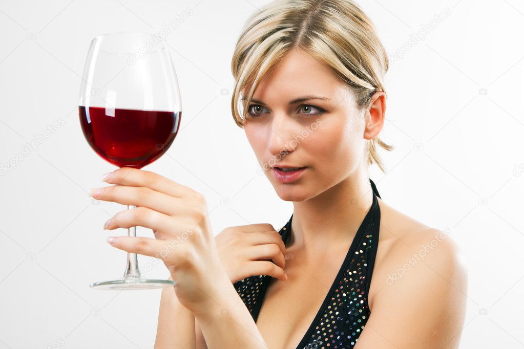 Young woman holding red wine