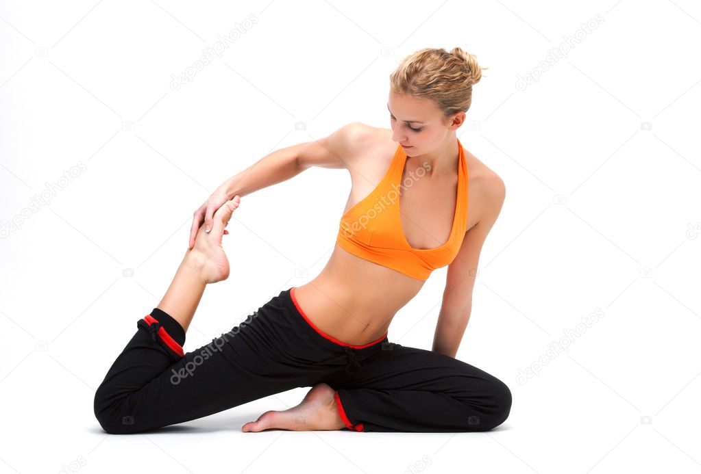 Younge woman stretching the muscles of her legs