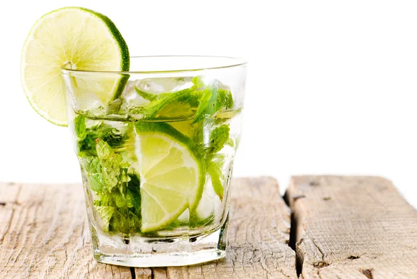 stock image Glass mojito lime wood