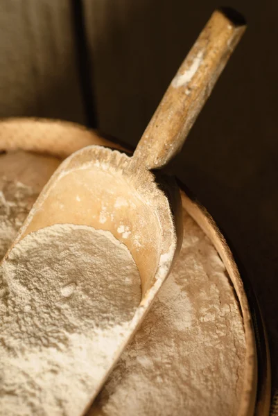 Wooden scoop with flour — Stok fotoğraf