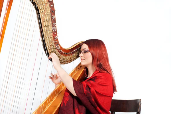 stock image Girl playing on a Harp