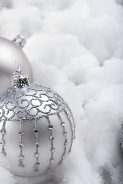 Silver baubles in snow — Stock Photo, Image