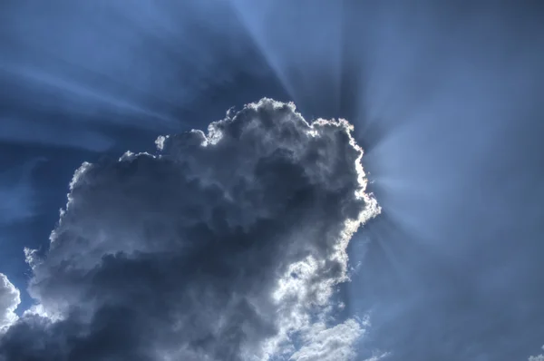 Sun behind clouds — Stock Photo, Image