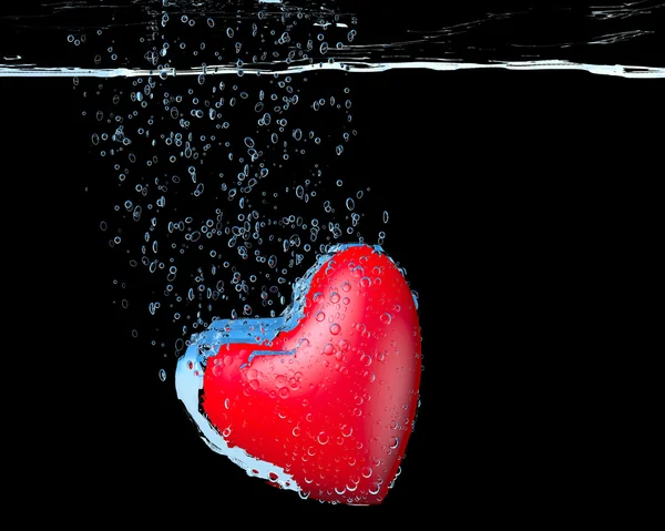 Heart dropped into water — Stock Photo, Image