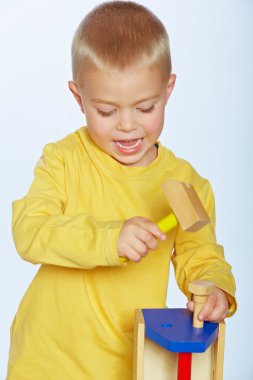 Boy with toy hammer clipart