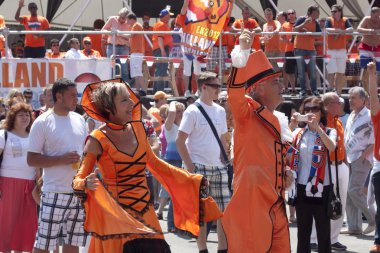 Unidentified Dutch fans in a flamboyant costumes clipart