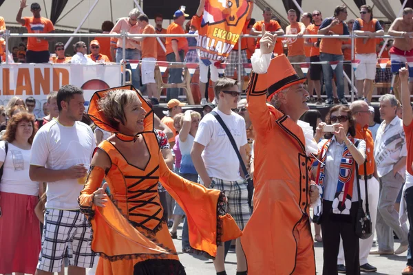 Unidentified Dutch fans in a flamboyant costumes Stock Picture