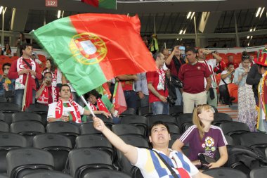 Fan waving the national flag of Portugal clipart